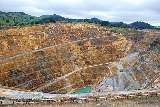istock Industrial gold mine surrounded by green hills 150509120