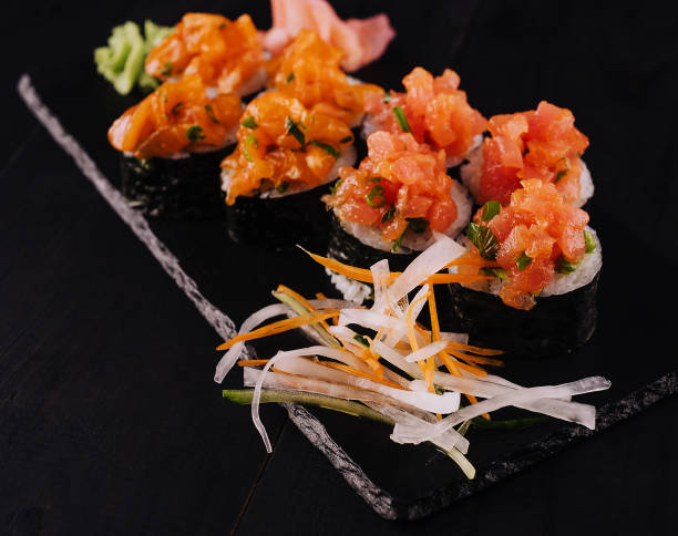 istock sushi maki rolls with sliced salmon on top 1505093091