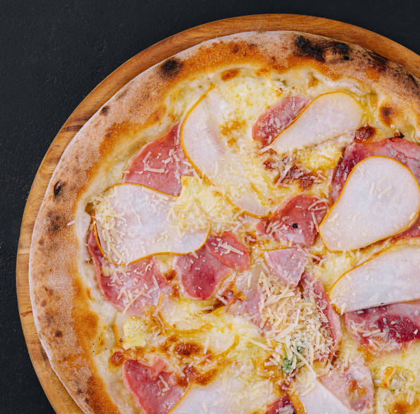istock Delicious meat pizza with salami, ham and cheese 1505105092