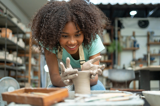 Follow the girl's journey of sculpting dreams in the ceramic workshop, where she shapes and refines clay with passion, creating unique and enchanting pieces.