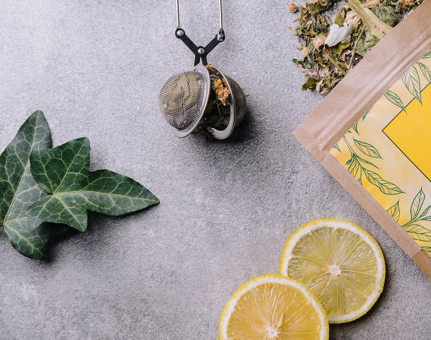istock Lemon slices and tea packaging top view 1505112711