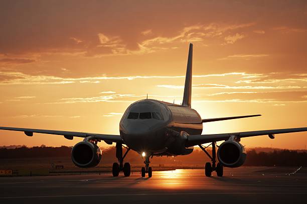 istock Jet airplane on runway at sunset 150513705