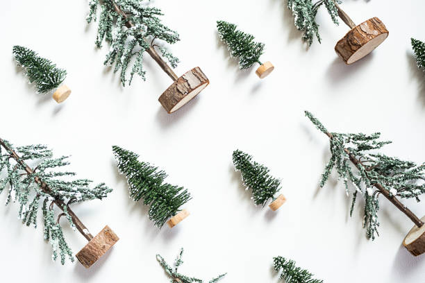 istock Mini artificial Christmas trees pattern. Decorative fir trees, winter holidays background. 1505142853