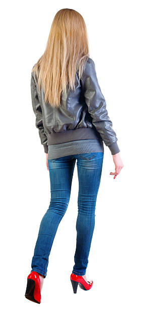 istock back view of going woman . 150514665