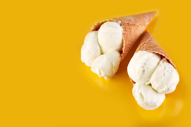 istock ice cream balls in a Waffle Cone on a Blue Background. Vanilla ice cream in a waffle cone. 1505164125