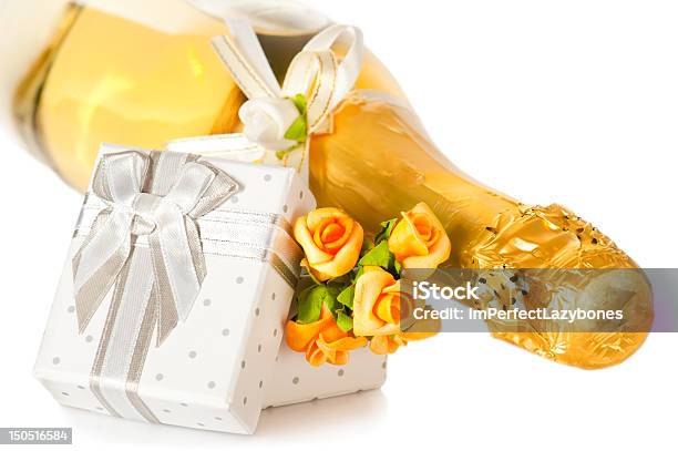 Champagne Bottle Present Box With Bow And Flower Boutonniere Stock Photo - Download Image Now