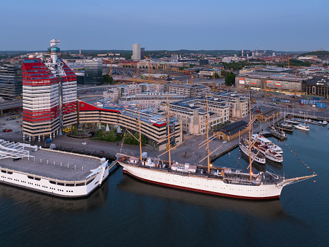 Aerial view of the Lilla Bommen district of Gothenburg in the evening. The ship in the foreground is Barken Viking from 1907, today a hotel. In the background is Nordstan shopping mall.