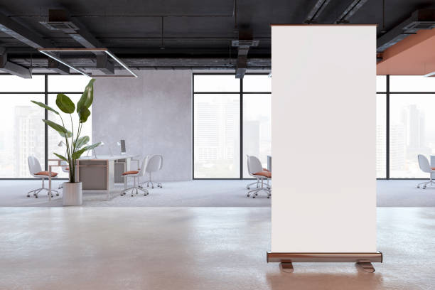 istock Contemporary coworking office interior with empty white roll-up banner, panoramic window and city view, equipment and furniture. Mock up, 3D Rendering. 1505177913
