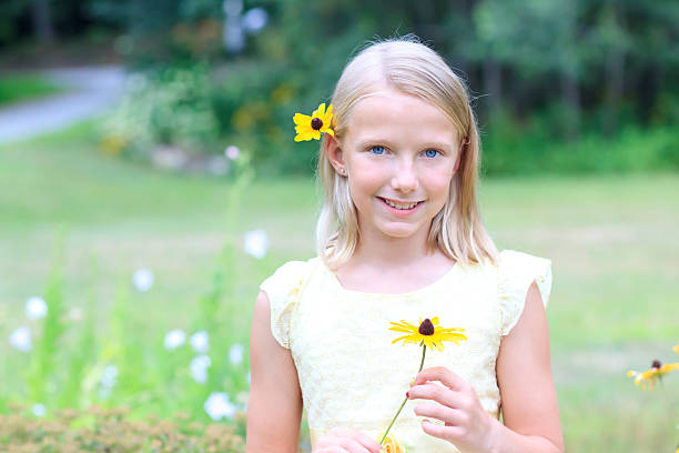 istock Blond Girl Holding a Flower 150518679
