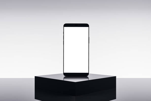 istock Empty white smartphone on pedestal and light background with mock up place. Product placement, technology presentation concept. 3D Rendering. 1505193265