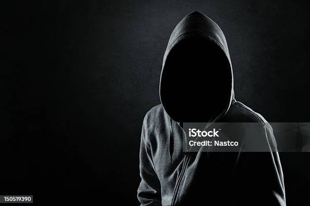 Man In The Hood Stock Photo - Download Image Now - Suspicion, Men, Criminal