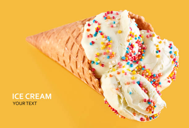 istock ice cream balls in a Waffle Cone on a Blue Background. Vanilla ice cream in a waffle cone. 1505196110