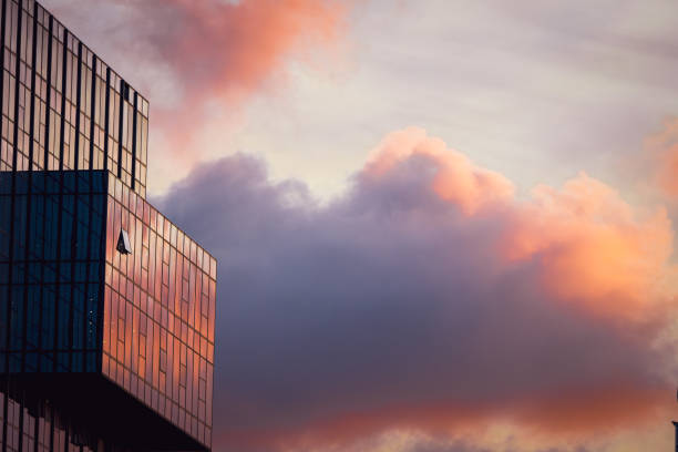 istock Office Buildings Against Colorful Clouds 1505199357