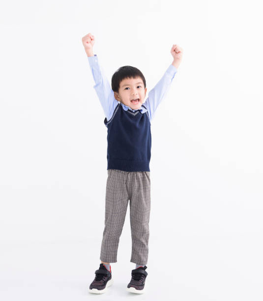 istock Happy asian boy  with success gesture isolated on white 1505203290