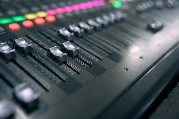 istock Professional audio mixing console. ​Mixer. Pro audio mixing board faders and knobs. Static shot of multi-track music recording equipment faders and sliders. 1505206201