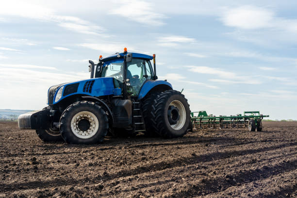 istock A tractor with seedbed cultivator ploughs field on morning. 1505225970
