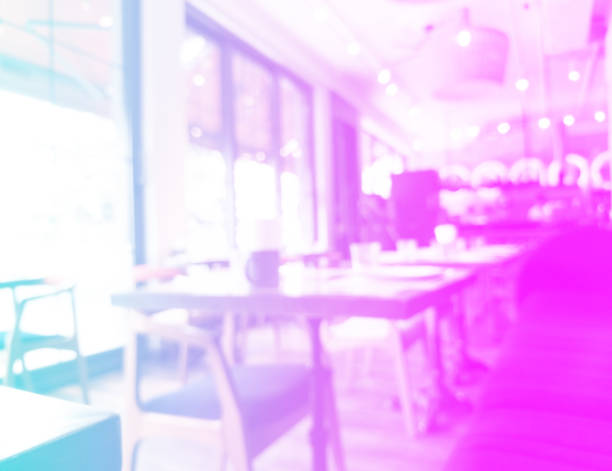 Cafe restaurant interior with customer and wood table blur abstract background with bokeh light. Blue and pink tones