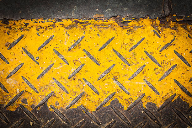 istock Dark steel floor plate paint with yellow pattern 150523993