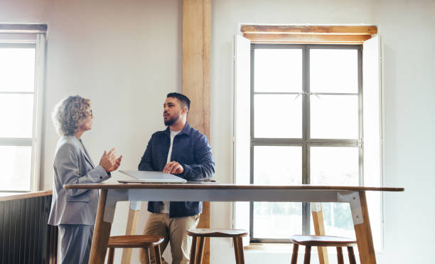 istock Two business professionals having a discussion in a coworking space 1505241016