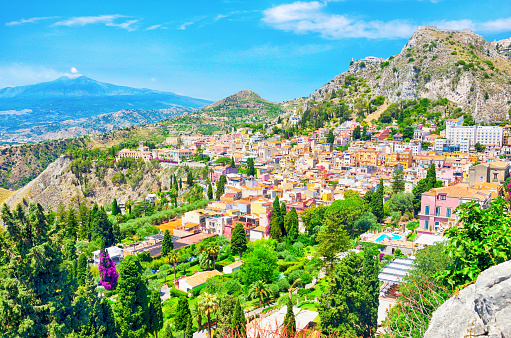 Panoramic view of Taormina town with Mount Etna on background