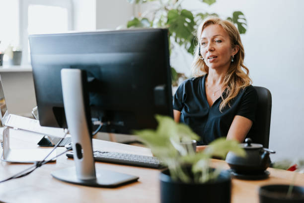 istock Businesswoman making a video call while working from office 1505295513
