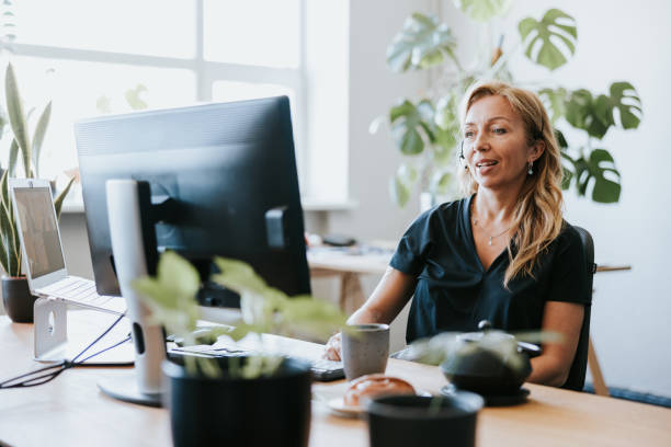 istock Businesswoman making a video call while working from office 1505295533
