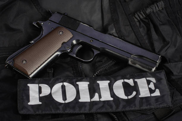 istock Police handgun on black uniform 1505308225