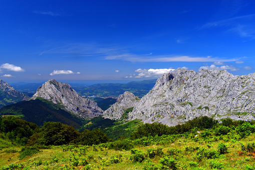 Landscape of the Urkiola Natural Park with the Untzillaitz (left), Axtxiki (center) and Alluitz (right) mountains. Biscay. Basque Country. Spain