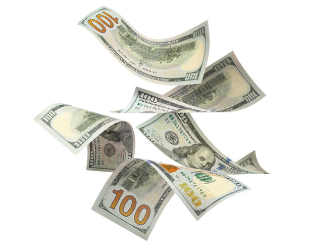 Flying 100 American dollars banknotes on white