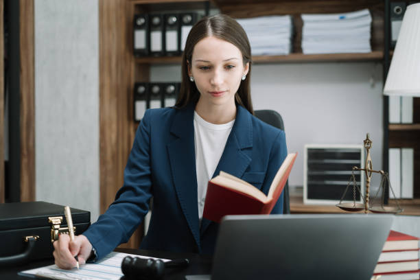 istock Serious pensive lawyer working at desk in office. 1505371283