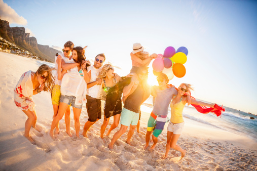 Young fun party people having fun on the beach with balloons. Pls checkout our lightboxes for further images 
