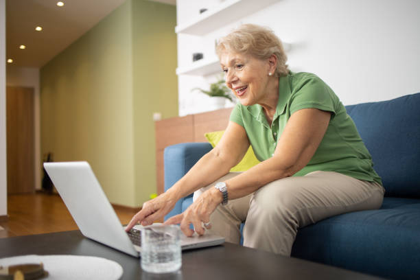istock Happy senior woman using laptop 1505377965