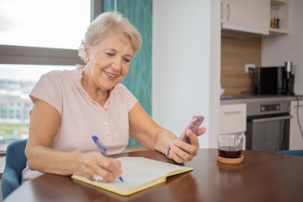 istock Happy senior woman using smartphone 1505377990
