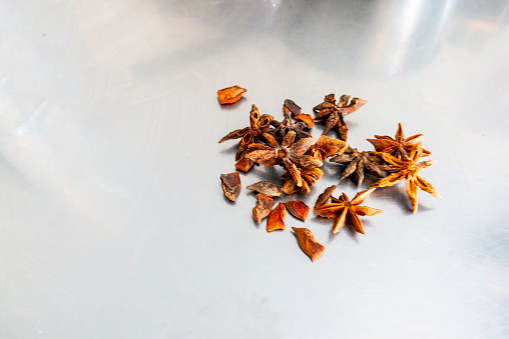 A group of star anise on metal table