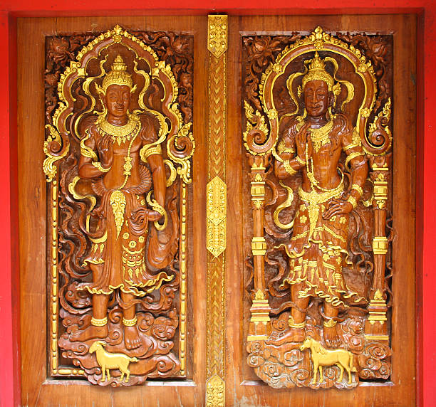 istock Carved wood thai temple 150537944