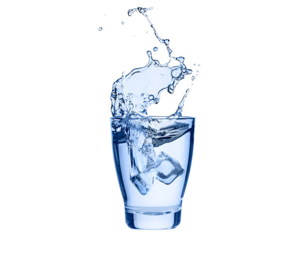 istock Ice cube splashes into glass of pure water 1505385058