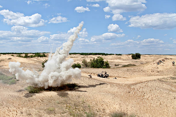 Ambush Large explosion near the car with soldiers in the desert land mine stock pictures, royalty-free photos & images