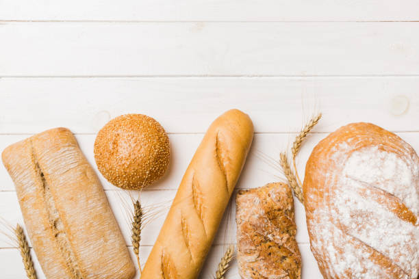 istock Homemade natural breads. Different kinds of fresh bread as background, top view with copy space 1505407136