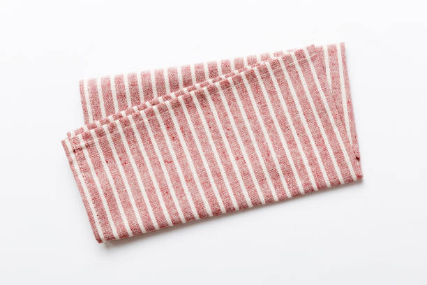 istock top view with red empty kitchen napkin isolated on table background. Folded cloth for mockup with copy space, Flat lay. Minimal style 1505407243