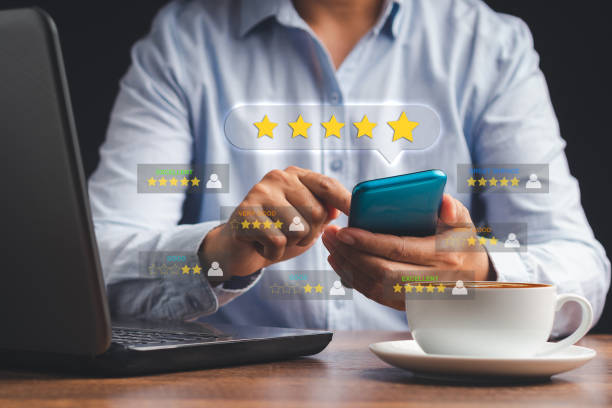 istock Man using a smartphone give the five-star icon a rating of very impressed for service 1505418335
