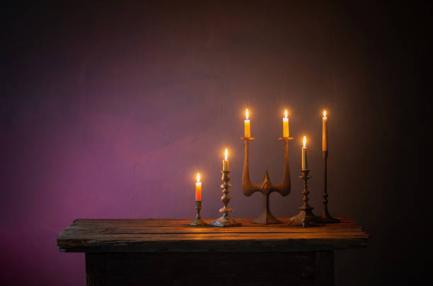 istock burning candles in vintage candlesticks on dark background 1505434828