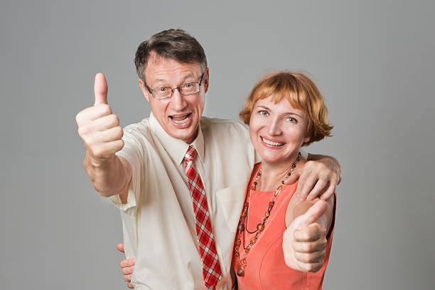 istock Smiling senior couple with thumbs up 150543917