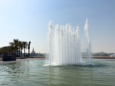 A tranquil fountain situated in a public park in Abu Dhabi, United Arab Emirates
