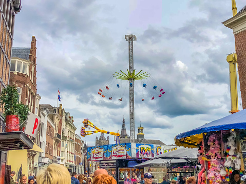 September 2018 - ‘s-Hertogenbosch, the Netherlands: Fair at the market square with a view on the St John Cathedral (St Jan) in Den Bosch