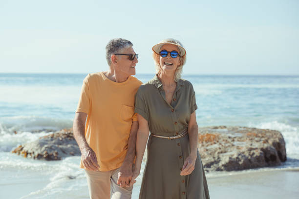 istock Affectionate senior couple on the beach holding hands 1505481934