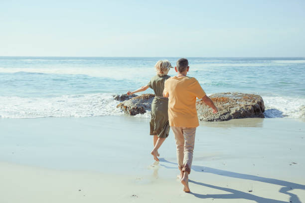 istock Affectionate senior couple on the beach 1505481975