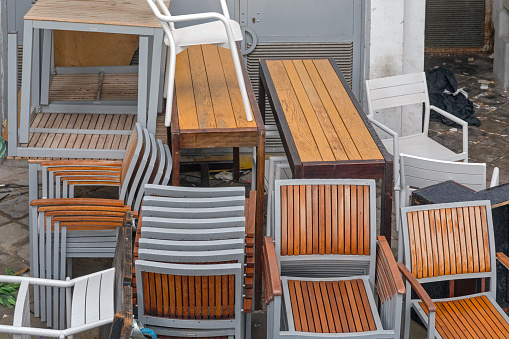 Stack of Chairs and Tables Restaurant Outside Storage
