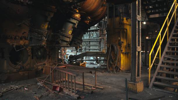 istock Interior view of an abandoned factory, featuring an array of broken machinery and debris 1505556887