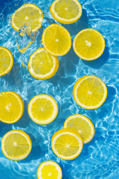 istock Creative summer composition made of sliced citrus in transparent pool water. Refreshment concept. Healthy refreshing drink theme. Top view 1505560412