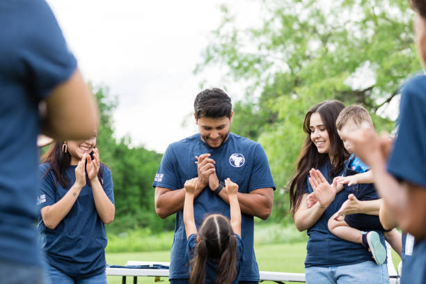 istock Father looks down at his daughter as she asks to be held 1505560674